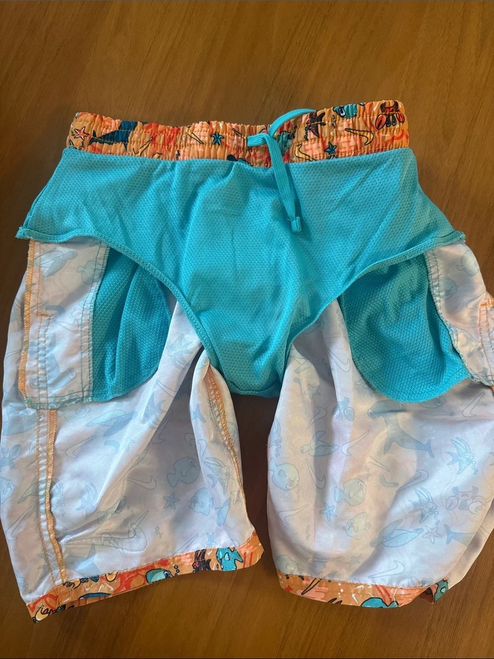 Nike Orange Swim Trunks with Blue Sea Creature Print. 7inch lined